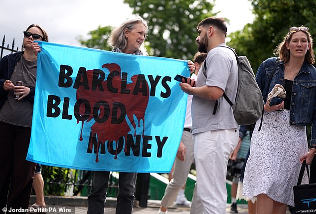 People protesting against Barclays' sponsorship of the Wimbledon Championships today