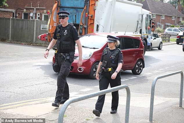 Kent Police officers on patrol in Gillingham today. The force says it will maintain a large presence in the area following the attack