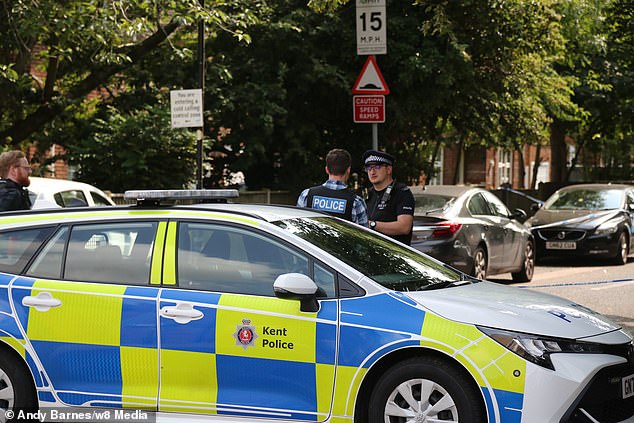 Police officers in Gillingham maintaining the cordon at the scene of the alleged stabbing today