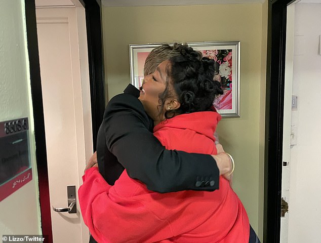 Proud: Lizzo shared some behind the scenes photo and praised the actor saying, 'Austin gives the best hugs. I"M SO PROUD OF HIM!'