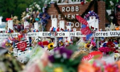 FILE - Flowers and other items surround crosses at a memorial, June 9, 2022, for the victims of a shooting at Robb Elementary School in Uvalde, Texas. (AP Photo/Eric Gay, File)