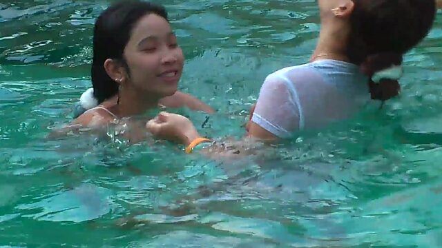 Asian cutie shows off her big tits in homemade pool fun