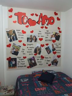 a room with a bed and a poster on the wall that says teo amo