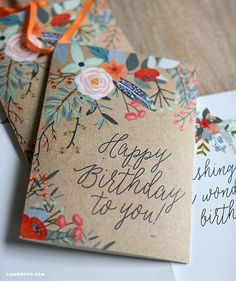 two birthday cards with flowers and birds on them