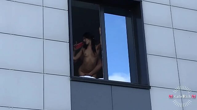Slim Brunette Gal Gets a Thrill Of Being Fucked By the Window, Knowing That People Are Watching Her