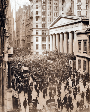 English: A crowd forms on Wall Street during t...
