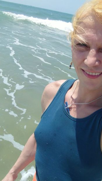 Transgirl swimming in red panties and blue t-shirt in Pacific ocean first time. Enjoying sun and hot weather. Wetlook tits in t-shirt.