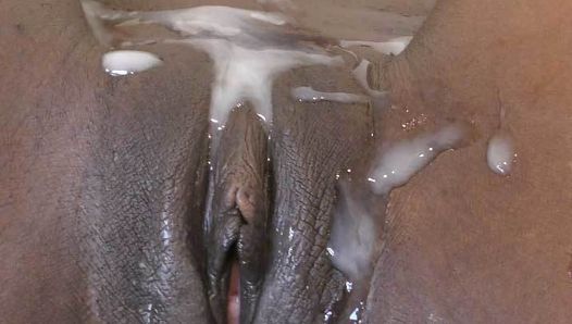 Chocolate pussy covered with thick cum
