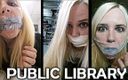 Selfgags classic: Блондинка з кляпом у роті в громадській бібліотеці