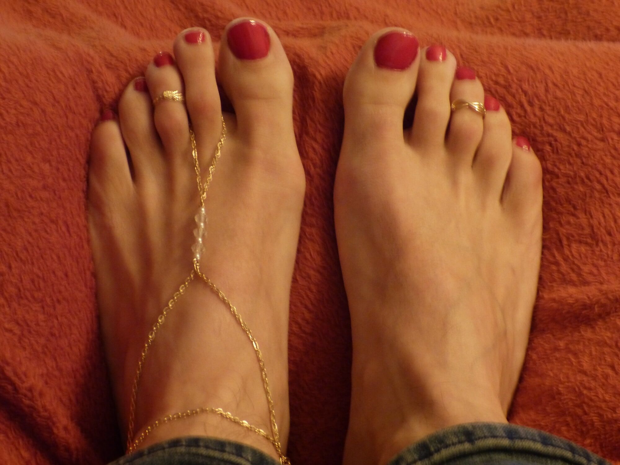 my feet in red polish, jewelry and heels