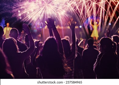 New Year concept - cheering crowd and fireworks  Stock Photo