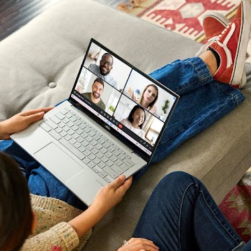 Overhead view of a seated person with a Chromebook in their lap.