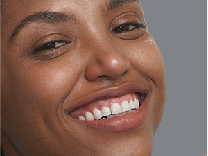 Woman smiling with soft, clean skin