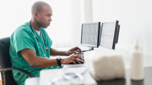 nurse working on computer