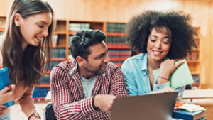 people smiling in library