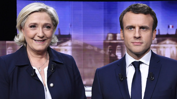 Marie Le Pen und Emanuel Macron. 03.05.2017, La Plaine-Saint-Denis, Frankreich.