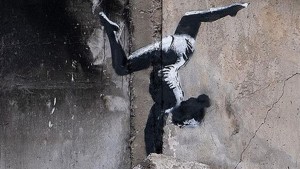 Banksy-Street-Art auf Häuserresten in der Ukraine