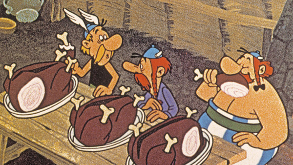 Obelix strahlt – das Wildschwein auch? In dieser Filmszene aus „Asterix, der Gallier“ von 1967 schmeckt es den Galliern zumindest.