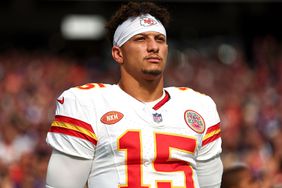 Patrick Mahomes #15 of the Kansas City Chiefs stands on the sidelines during the national anthem prior to an NFL football game against the Minnesota Vikings at U.S. Bank Stadium on October 8, 2023 in Minneapolis, Minnesota. 