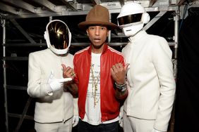  Pharrell Williams (center) and Daft Punk attend the 56th GRAMMY Awards at Staples Center on January 26, 2014 in Los Angeles, California