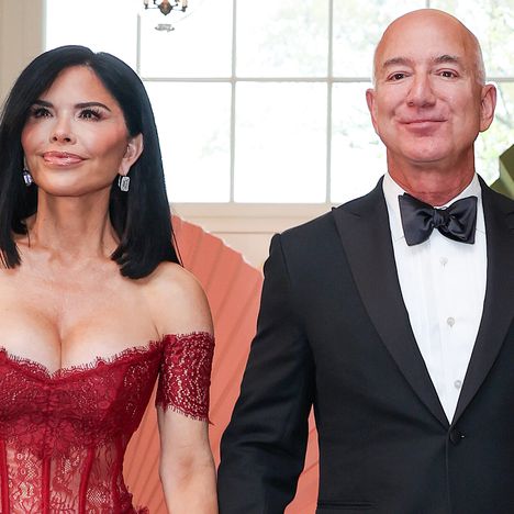 Jeff Bezos (R) and his fiancee Lauren Sanchez