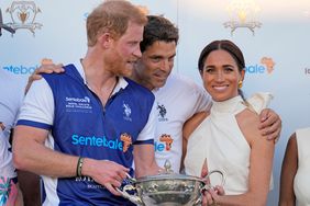 Argentine professional polo player Ignacio "Nacho" Figueras, center, embraces Britain's Prince Harry, left, and wife Meghan Markle, Duchess of Sussex, during the prize ceremony for the 2024 Royal Salute Polo Challenge to Benefit Sentebale, Friday, April 12, 2024, in Wellington, Fla. Prince Harry, co-founding patron of the Sentebale charity, will play on the Royal Salute Sentebale Team.